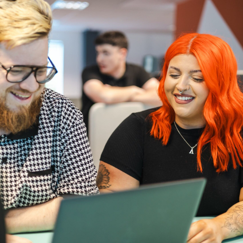 colleagues at a laptop