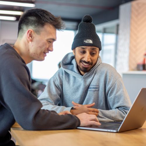 colleagues at a laptop