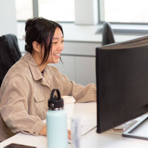 colleagues at a laptop