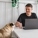 An Admiral employee working with his dog