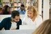 Retired teacher tutoring in a classroom