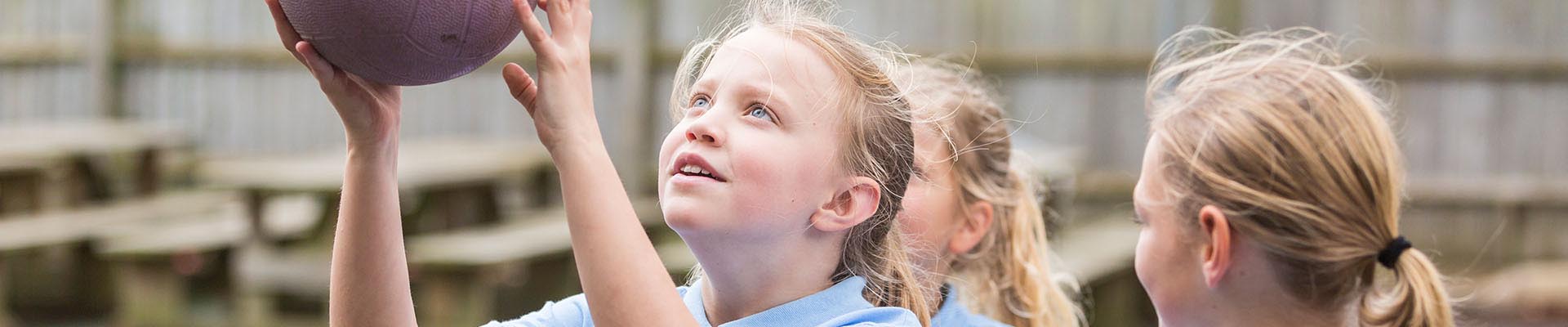Pupil playing volleyball