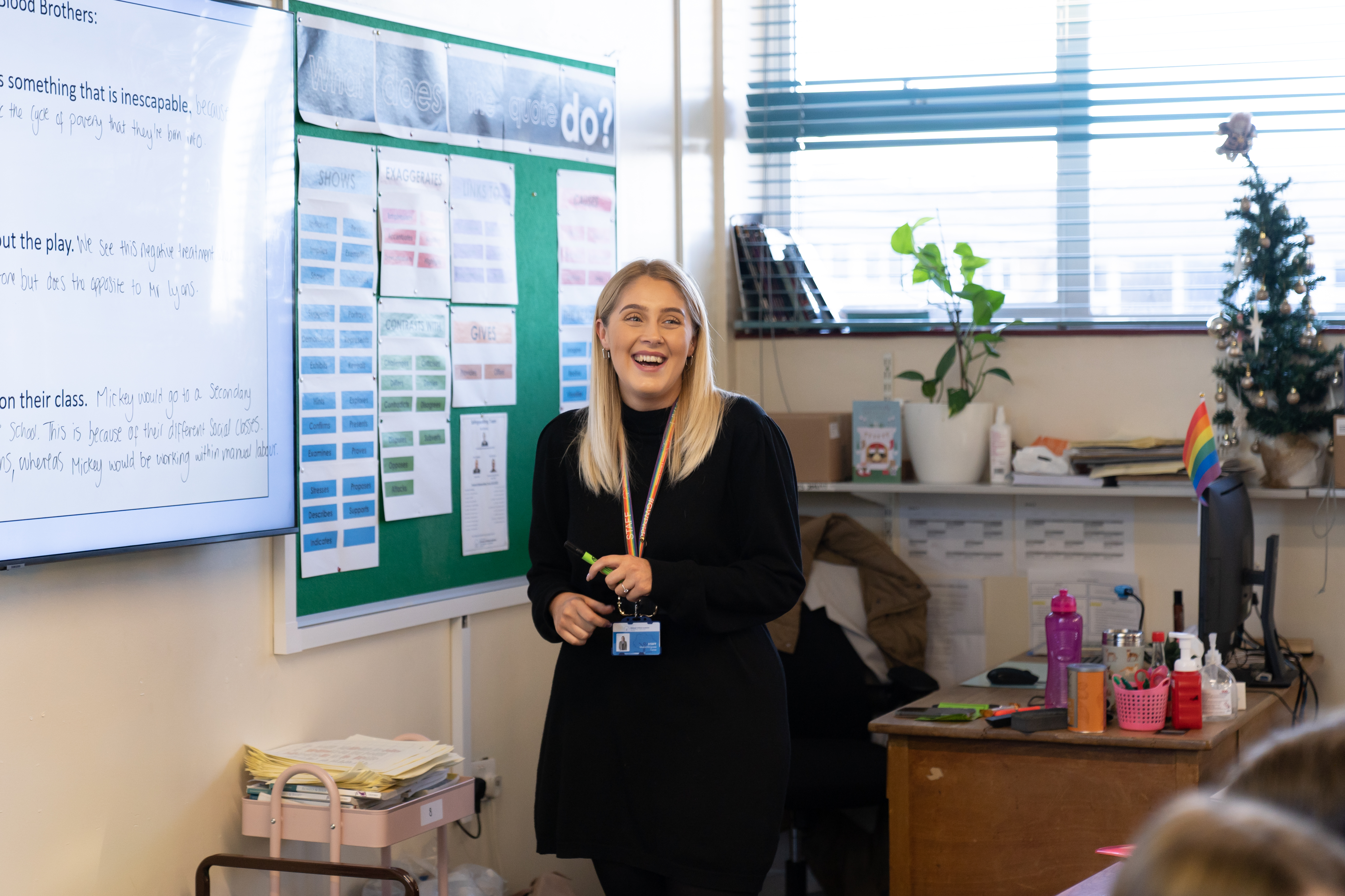 Teacher smiling while teaching 