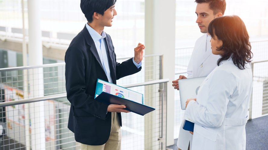 Salesman offering to two doctors