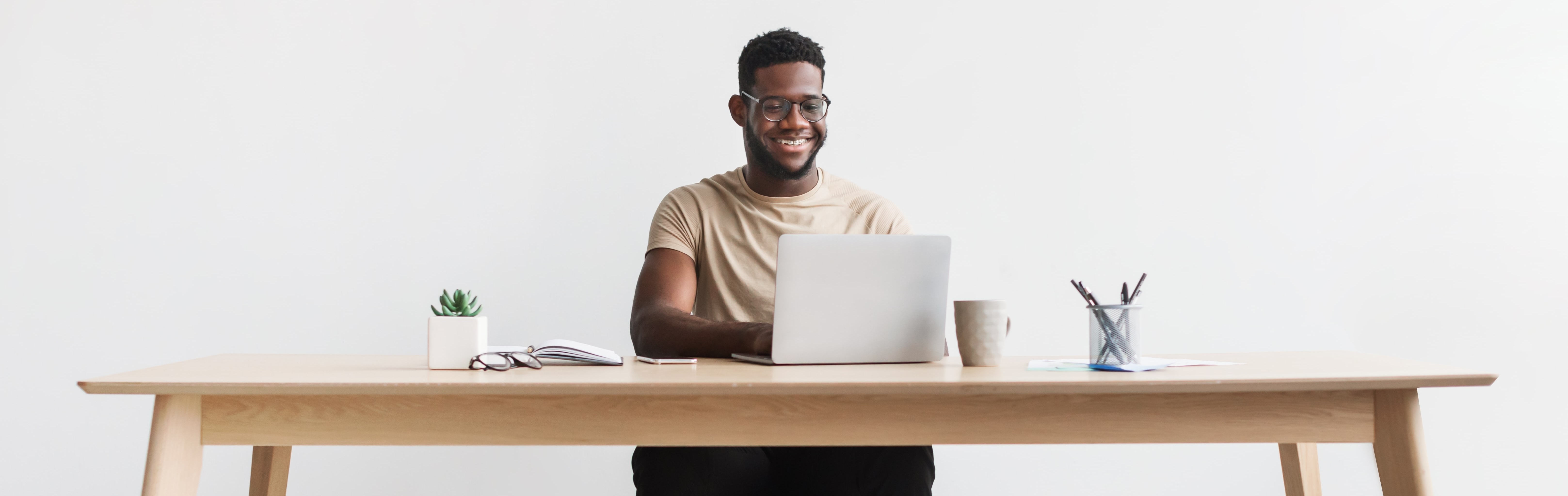 A virtual sales representative sat at a laptop on a desk.