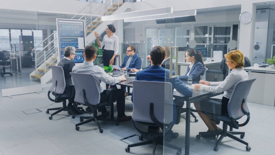 team sitting at a conference table