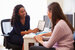 Patient Having Consultation With Female Nurse Advisor In Office