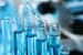 Close up of pipette dropping blue liquid. Concept for global vaccine market