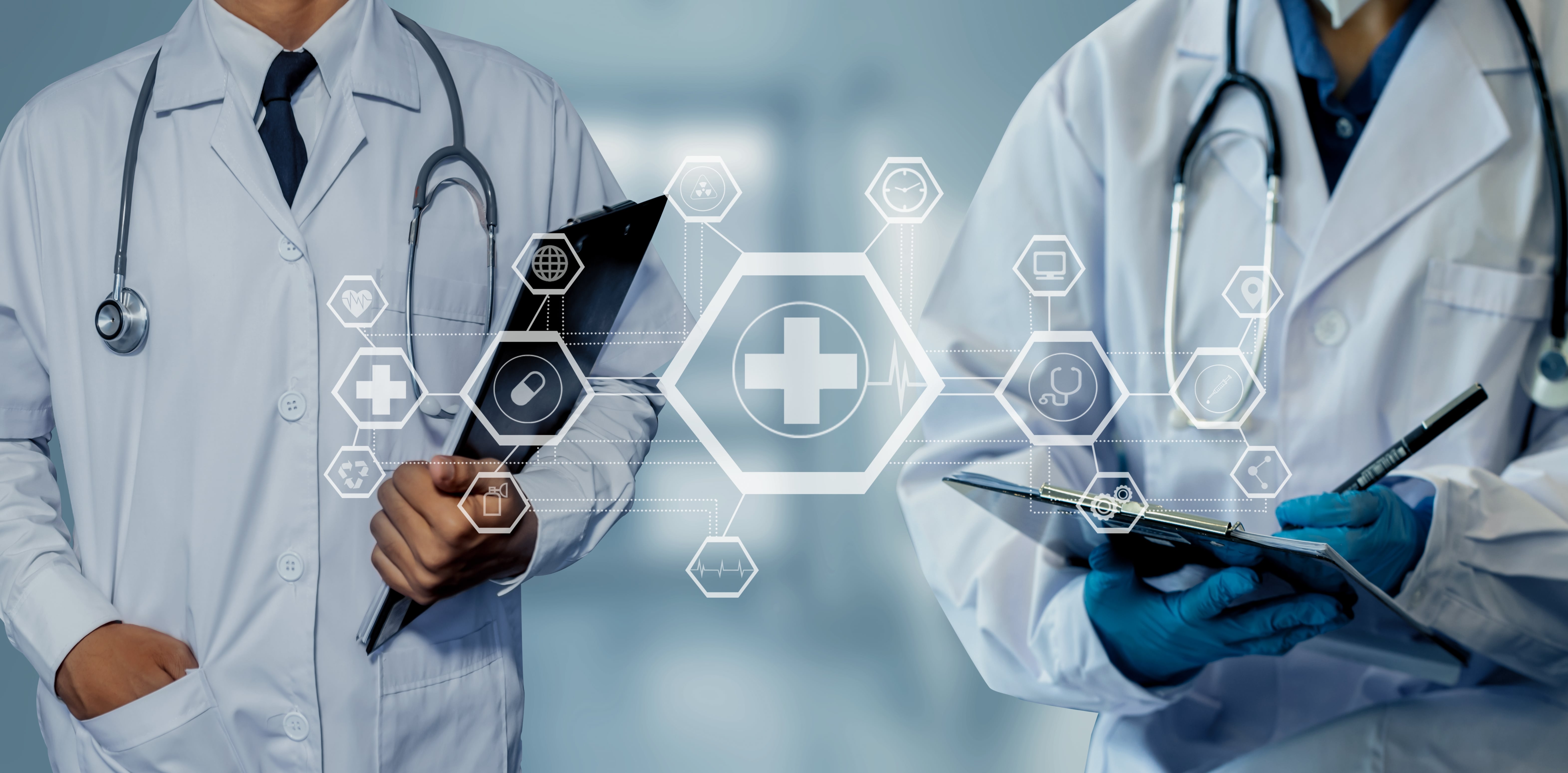 Doctors and modern virtual screen interface icons in front of them with healthcare symbols.