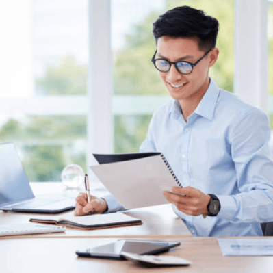 employee smiling looking at notepad