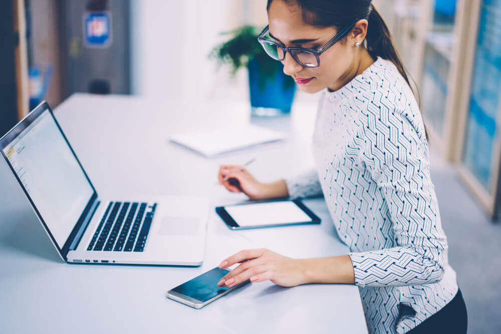 women working at a laptop