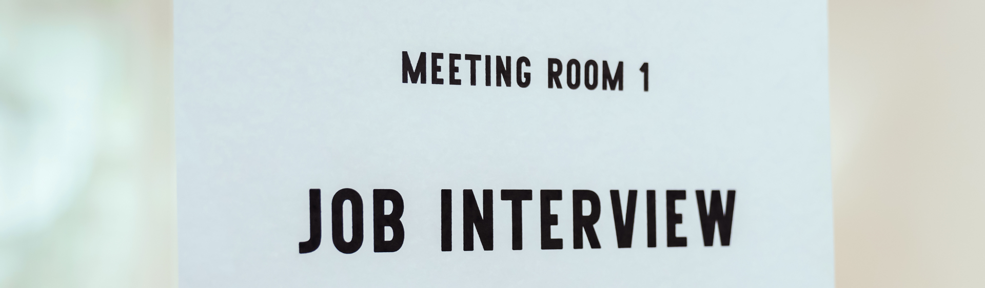 sign that says 'meeting room 1' - 'job interview'