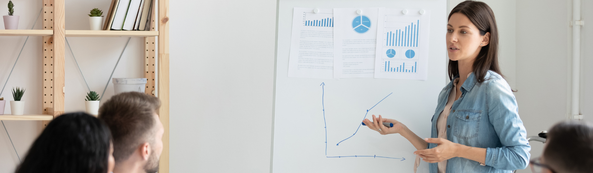 Female presenting a whiteboard 