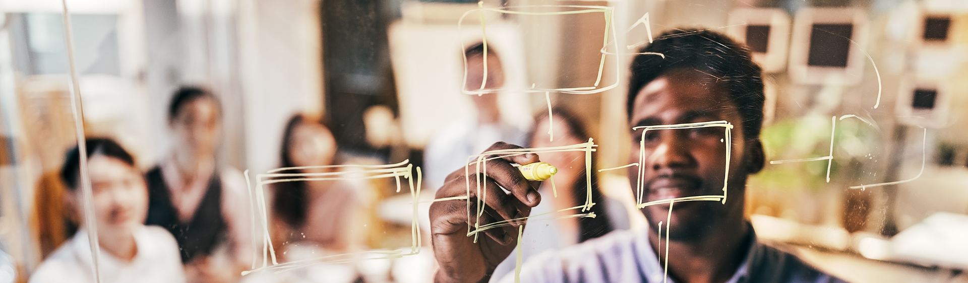 Man drawing on whiteboard