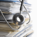 stethoscope on paper records