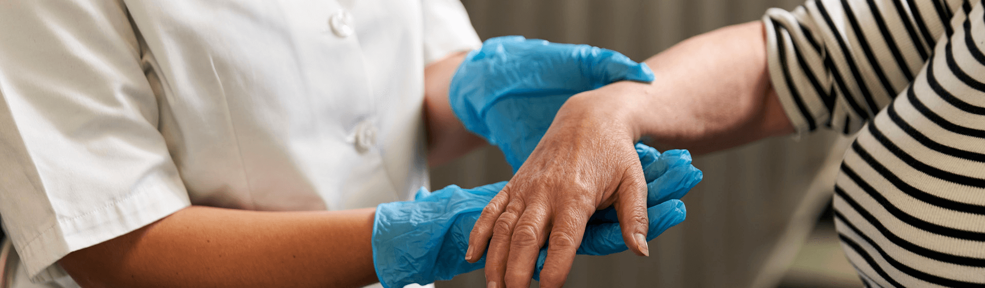 nurse holding patients hand