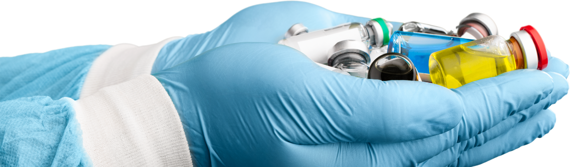 Hand wearing medical glove holding medicines