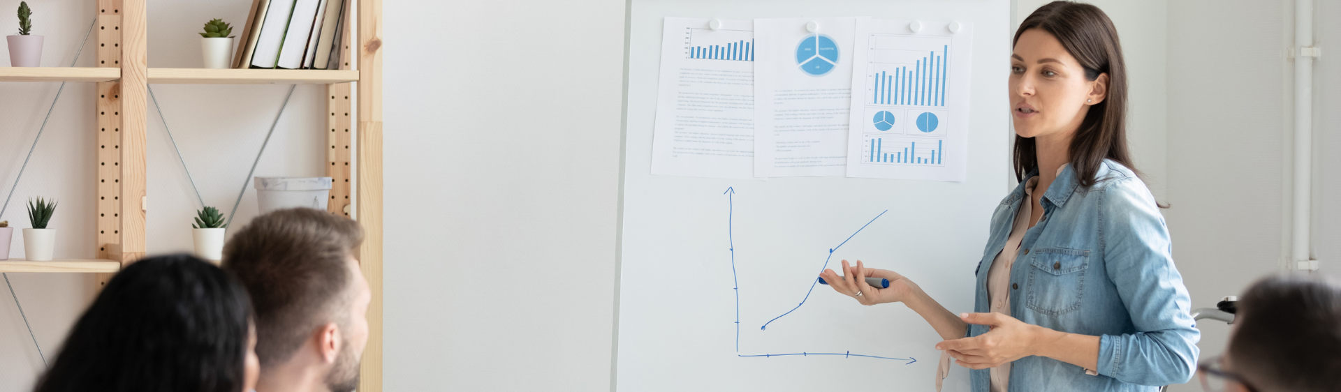 Female presenting a whiteboard