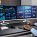 Two computer monitors with data graphs