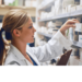 female pharmacist selecting medicine