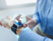 A picture of a smart watch with a holographic globe coming out of it 