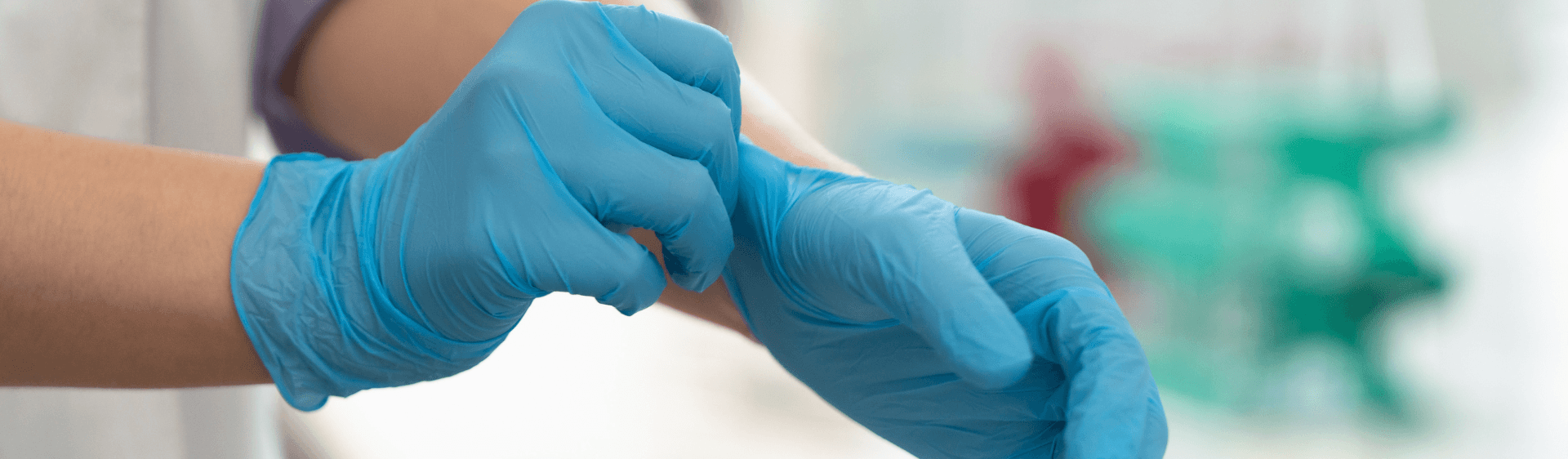 Image of medic putting on safety gloves