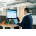 Man at standing computer desk