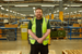 image of distrubution and warehouse worker smiling at the camera