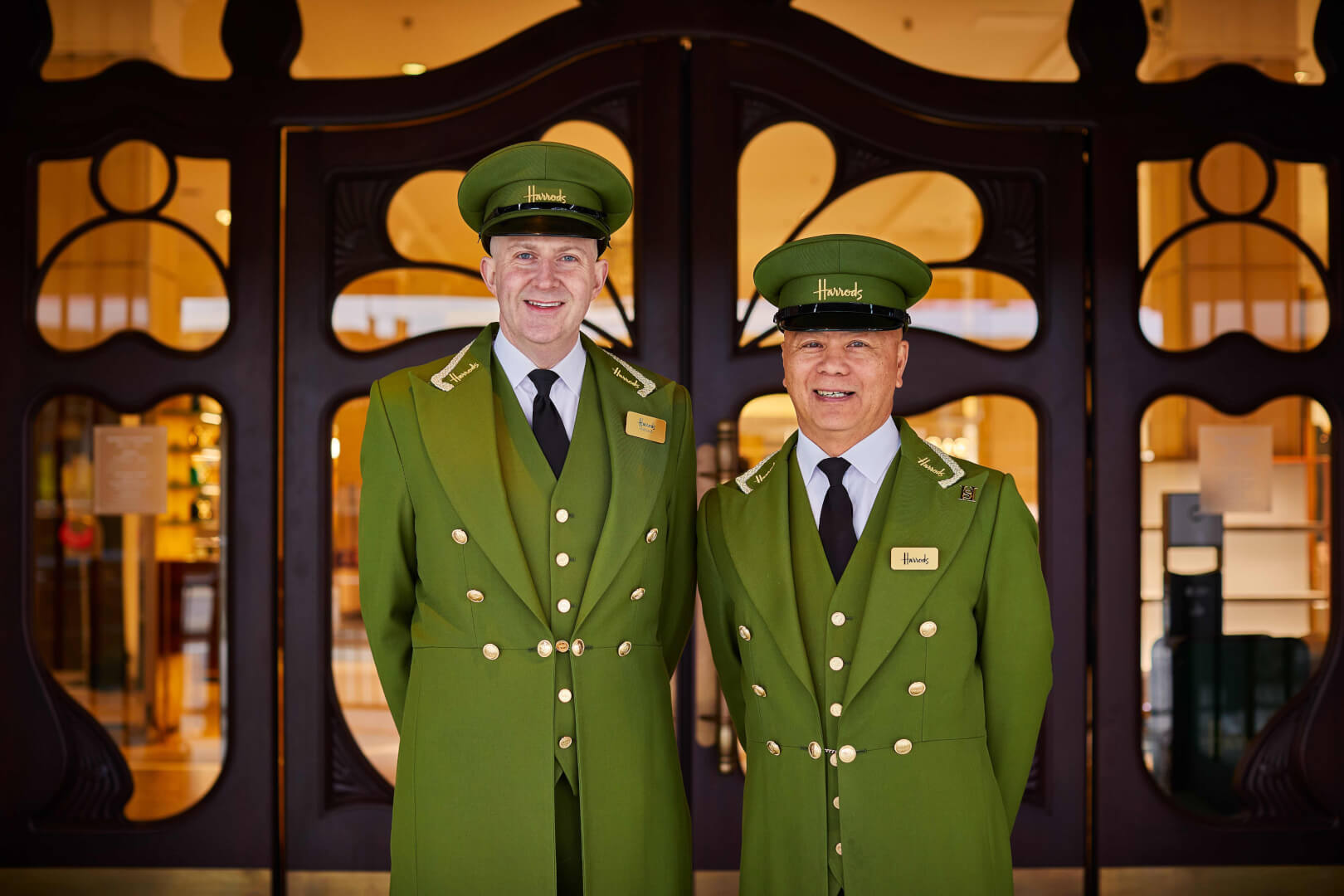 two men in uniforms smiling