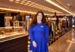 sales associate smiling in a harrods store