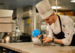 image of pastry chef in london piping some desserts