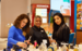h beauty colleagues at a harrods store looking at perfumes 