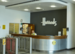 harrods head office image with man sitting at reception 