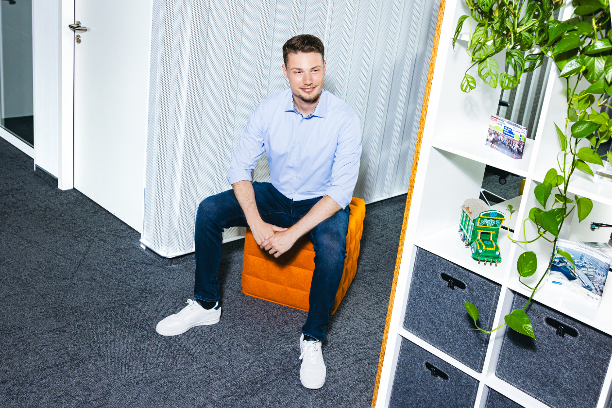 a professional sitting on a stool