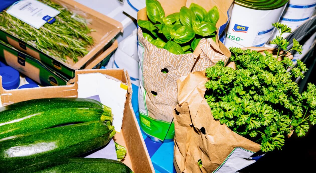 fresh produce placed in company branded cartons and paper bags