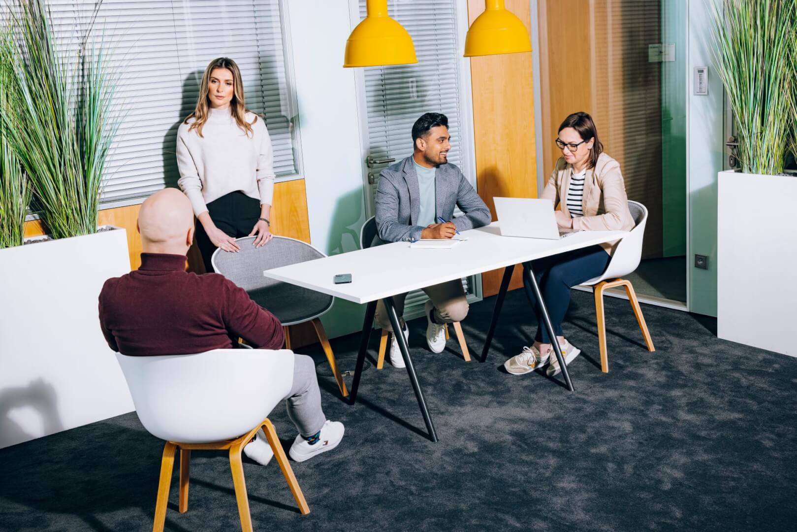 different sets of people engrossed in separate conversations sitting in a common space.
