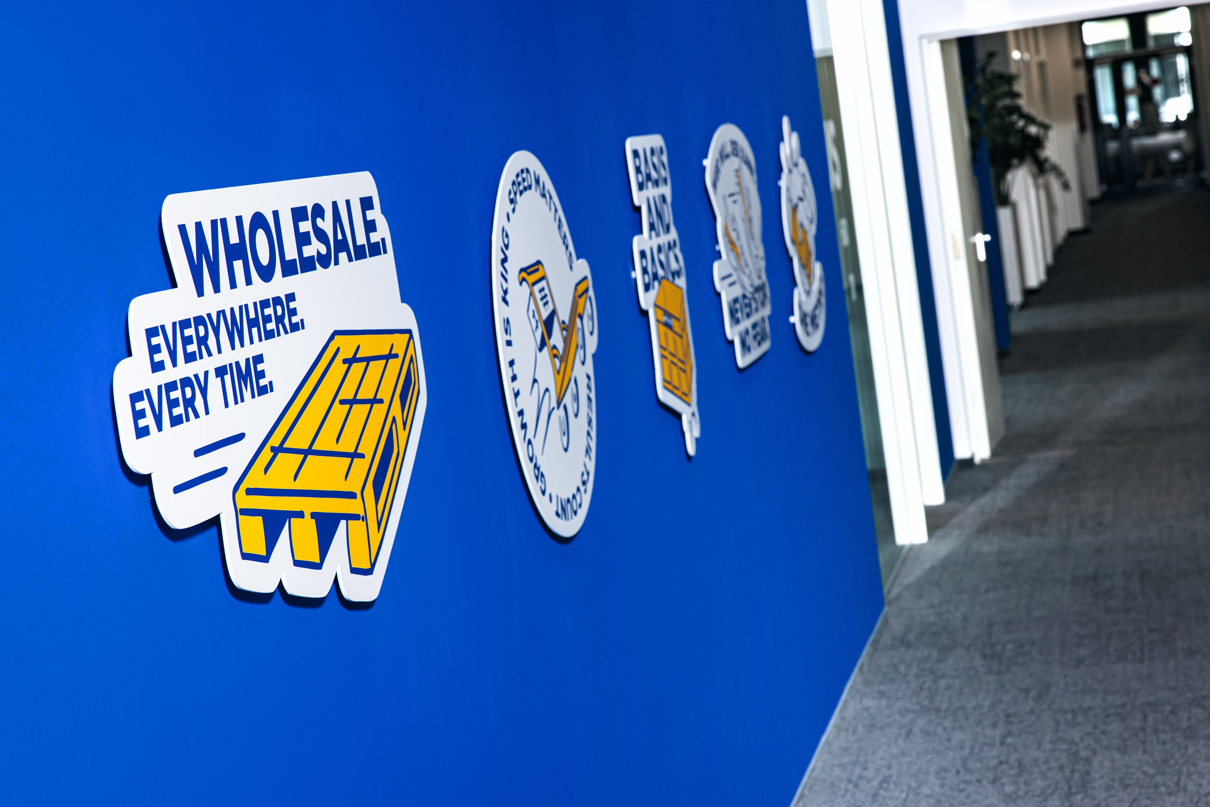 a wall from the office space covered with graphics