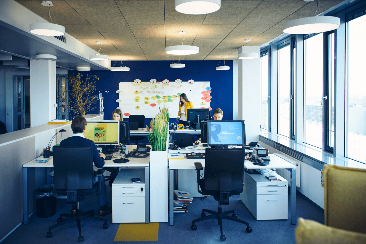 a modern office space with people working 