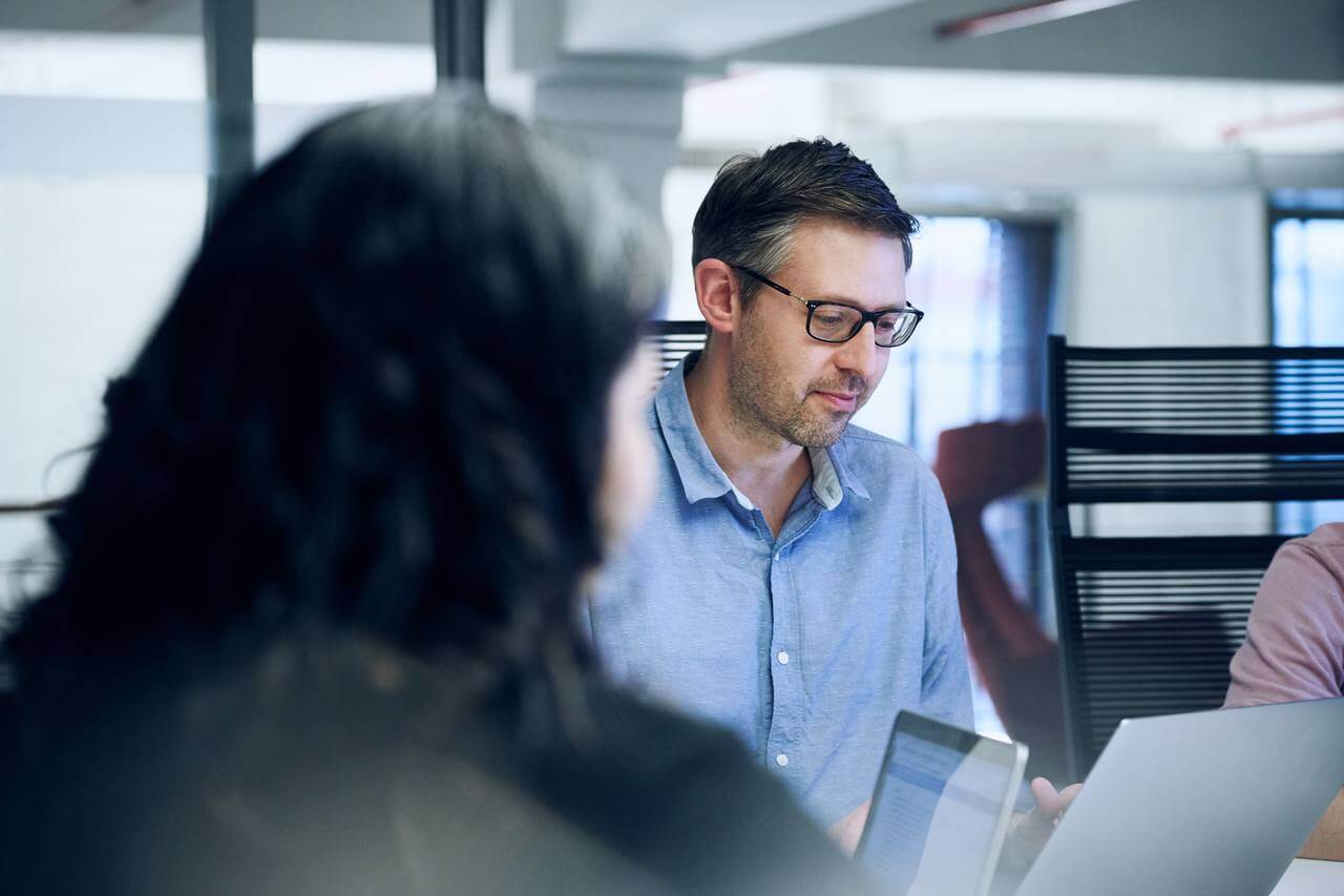 a professional working on his laptop