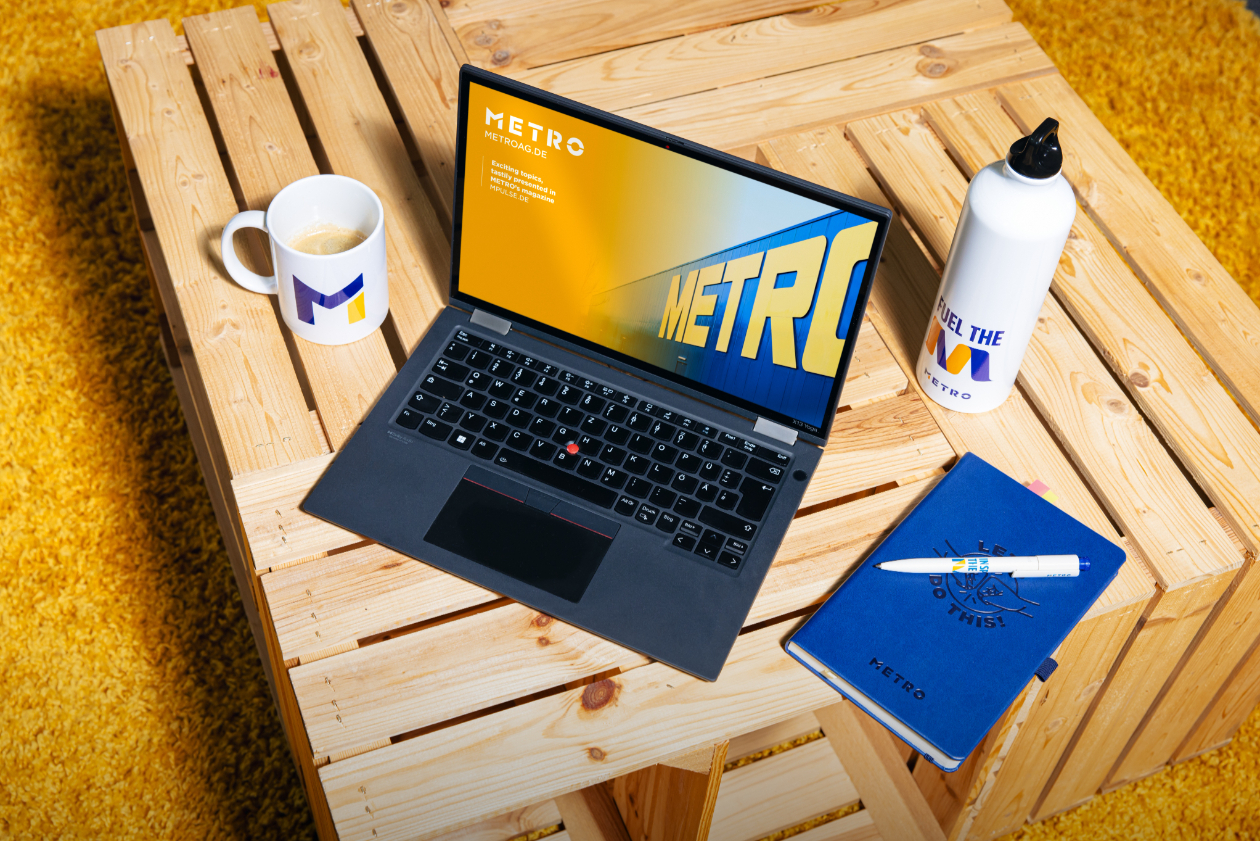 company branded work essentials - coffee mug, laptop, stationary and a bottle