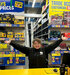 Toolstation employee smiling at a till