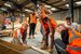 a group of people wearing PPE building
