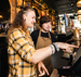 Pub Manager showing an Apprentice how to work the till 