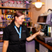 Apprentice learning how to make a coffee at a Greene King pub 