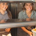 kitchen assistant with teammate in a greene king kitchen smiling