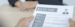 Interviewer holding a resume