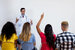 Medical students listening to doctor at classroom of university
