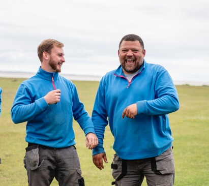 Photo of two maintenance workers on a holiday park