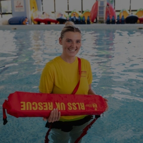 Image of lifeguard stood in a swimming pool