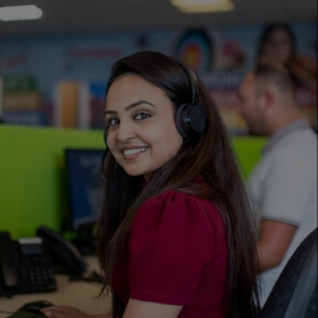 Image of contact center employee wearing a headset